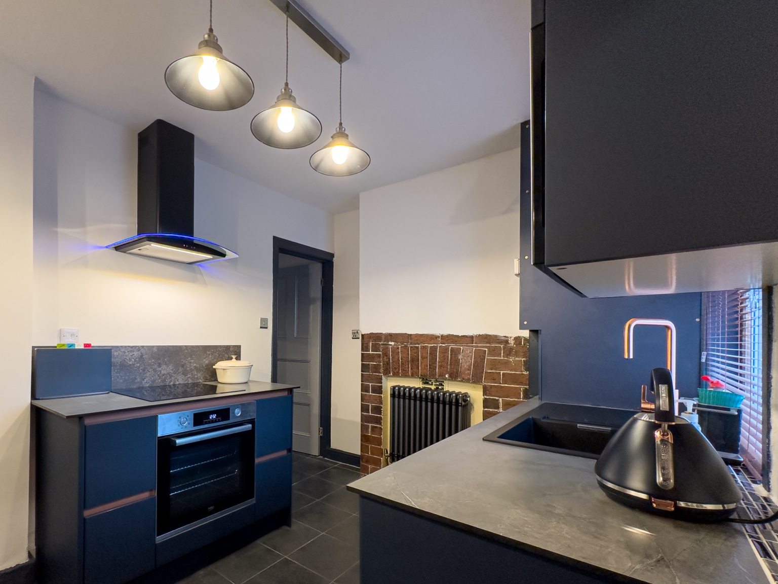 Dark contemporary fitted kitchen